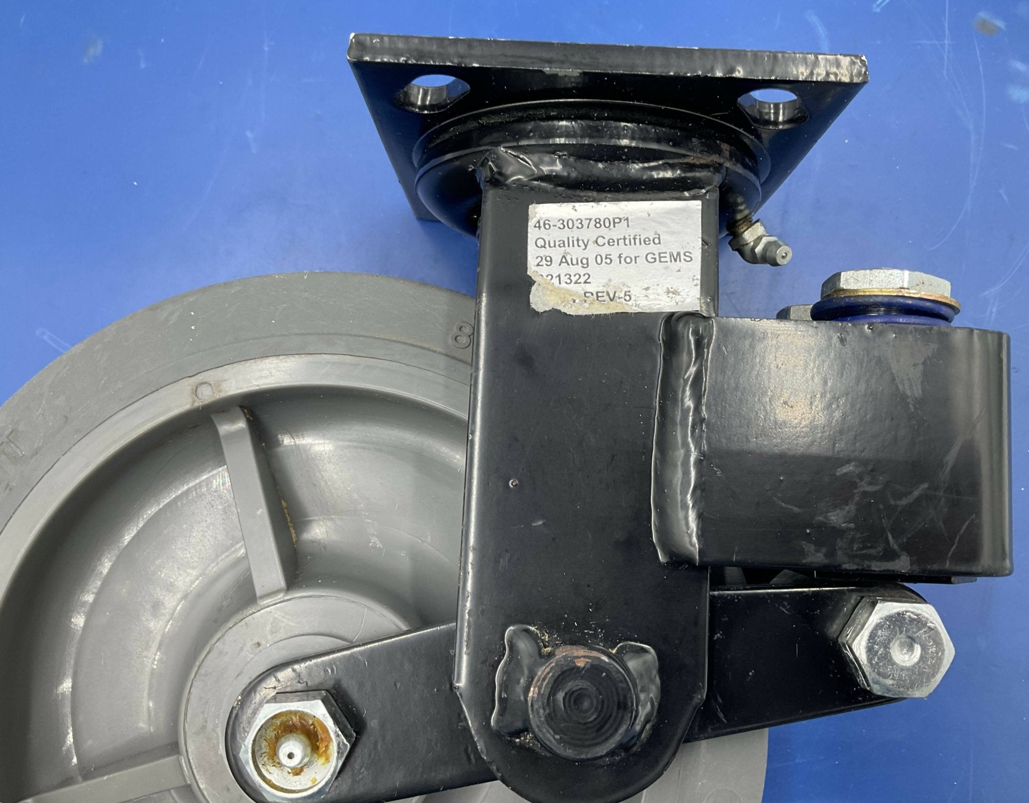 GE 46-303780P1 - Shock Absorbing Spring Caster AMX 4 Side View | Alo Tech Solutions
