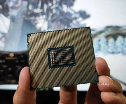 A person holding a server-grade Intel Xeon E5-2650 v4 processor