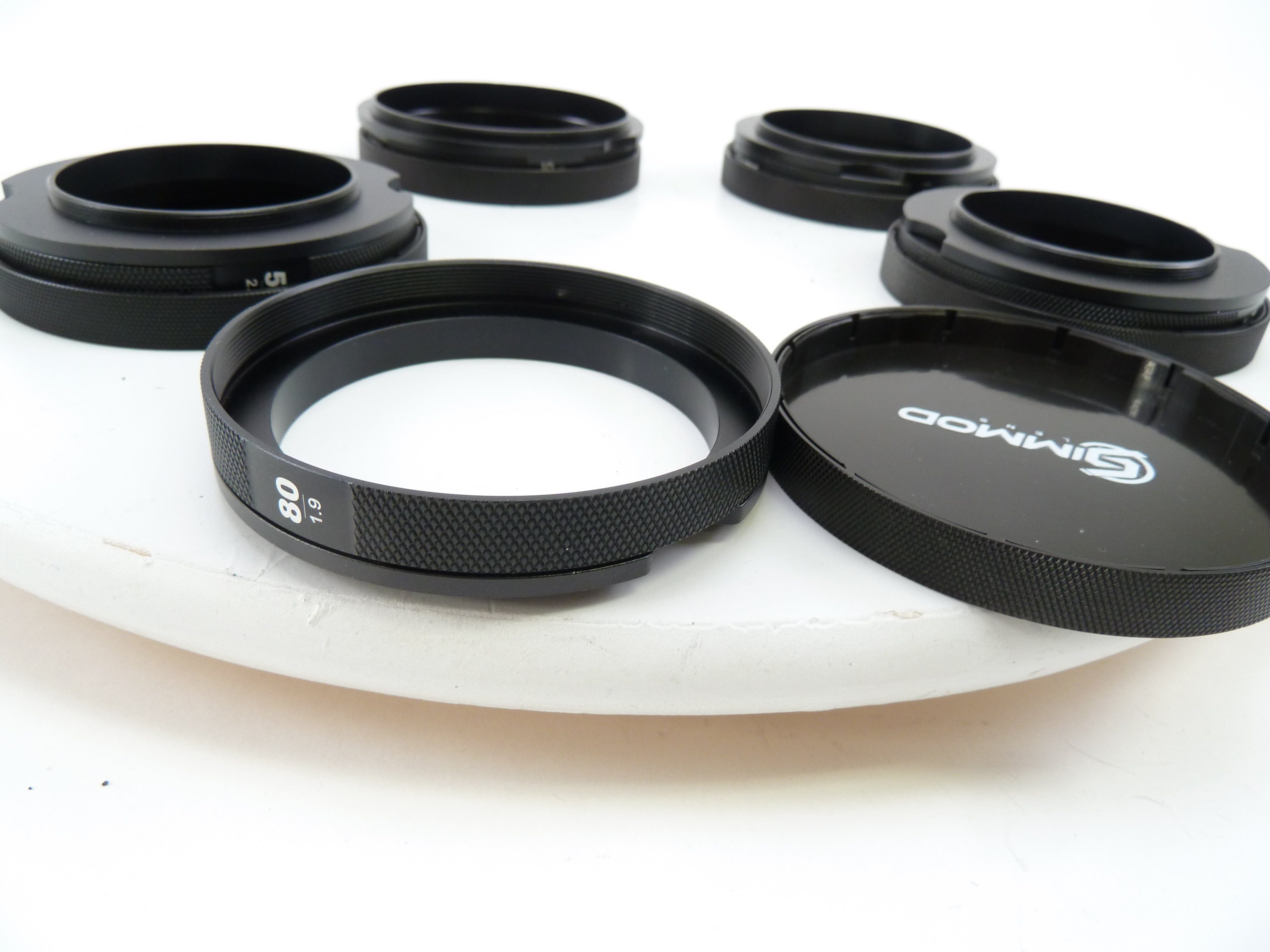 Simmod hoods with caps for 5 Mamiya Lenses