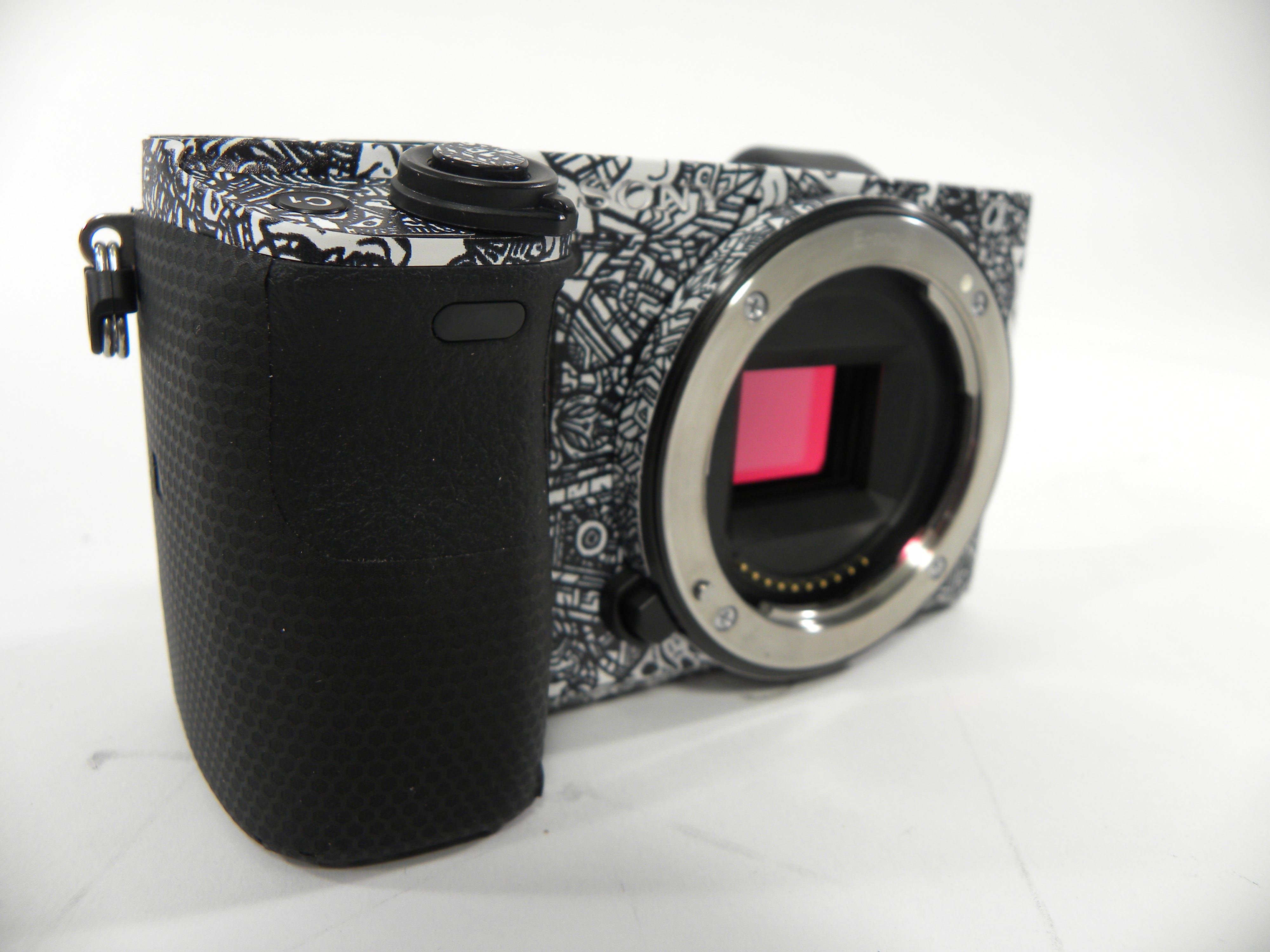 Sony a6400 24.2mp Mirrorless Digital camera Body Only  w/Skin Shutter Ct. 5,061